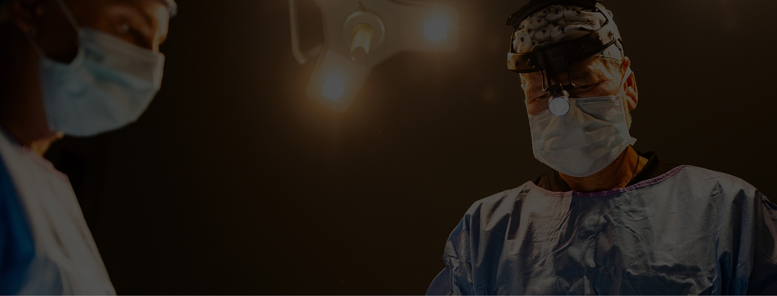 Surgeons performing a procedure in operating room.