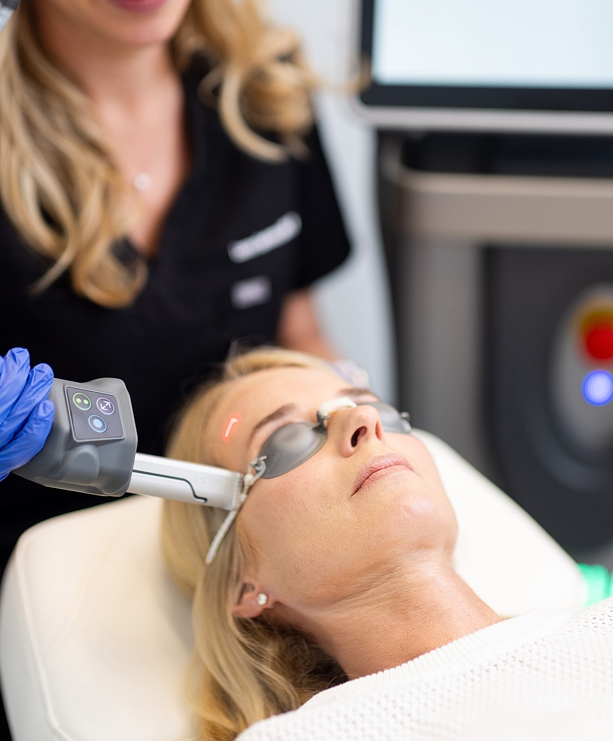 Woman receiving a cosmetic skin treatment procedure.