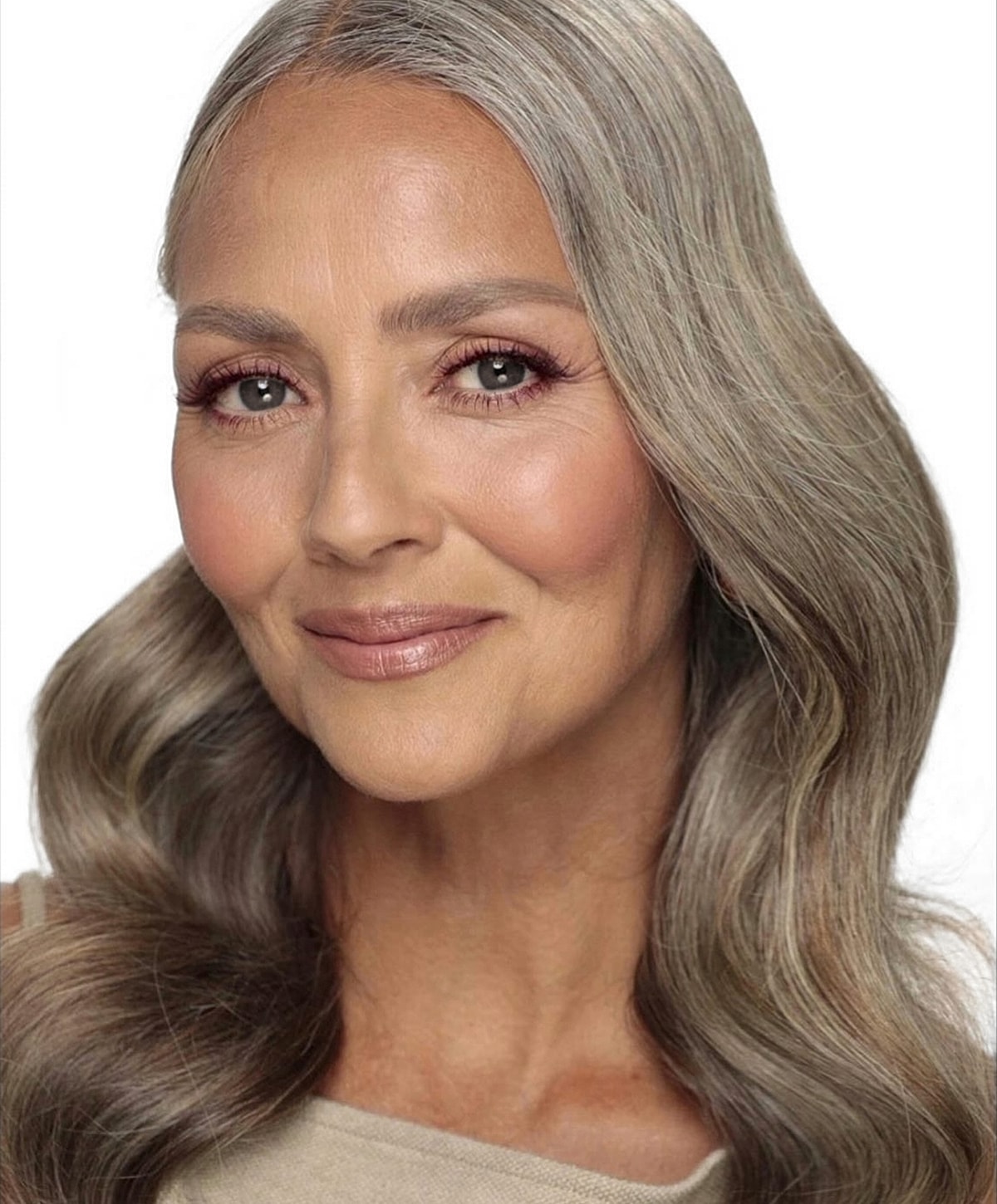 Smiling woman with long gray hair