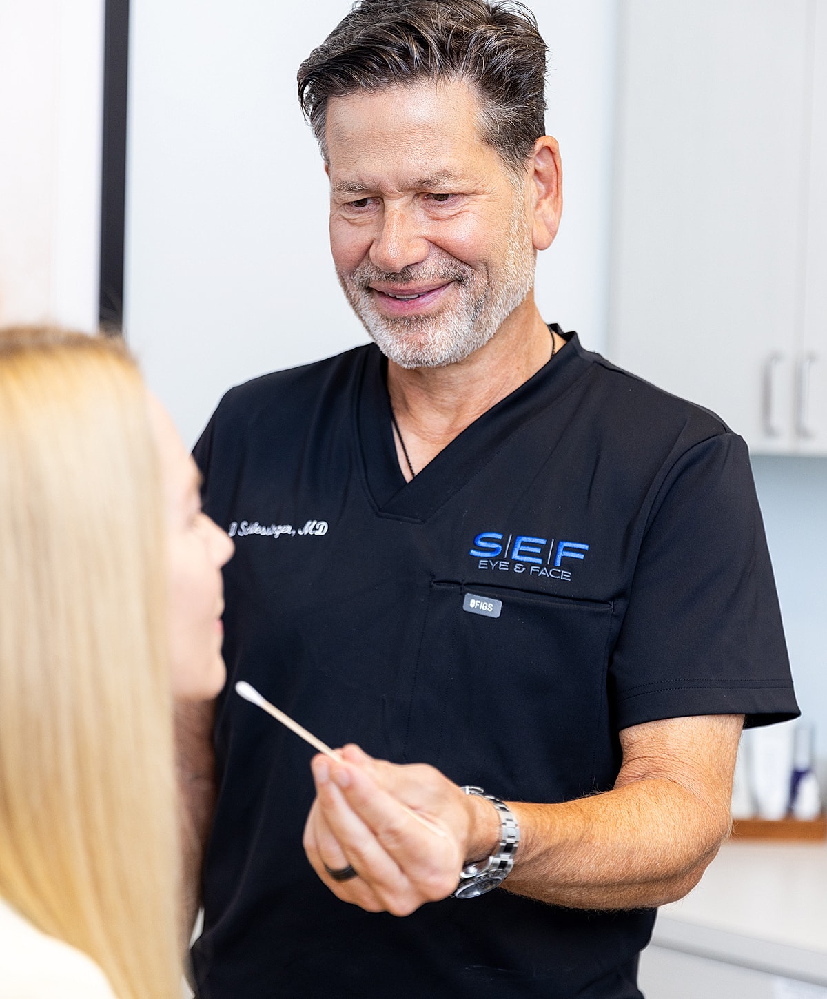 Medical professional consulting with a patient.