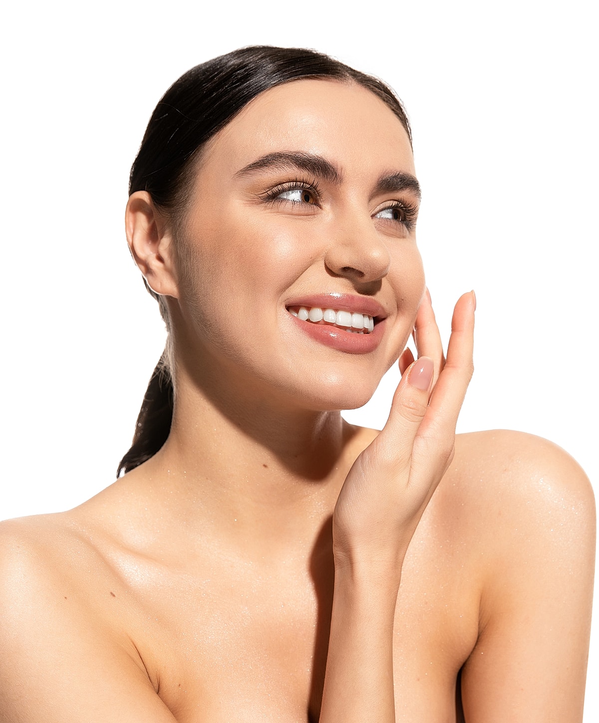 Smiling woman touching her face with confidence.