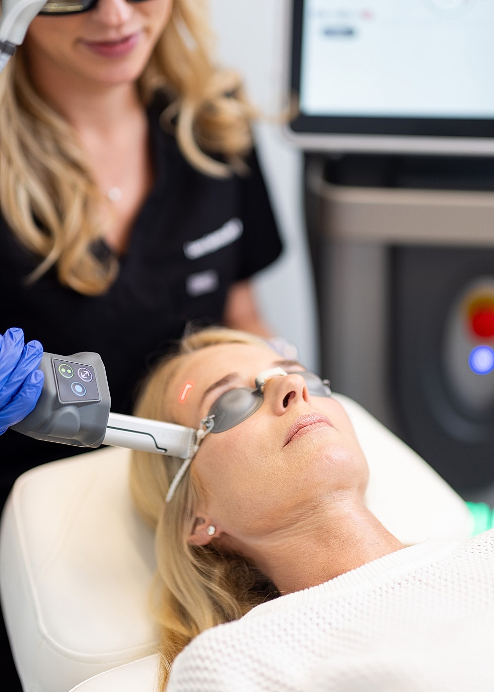 Woman receiving a laser treatment in clinic.