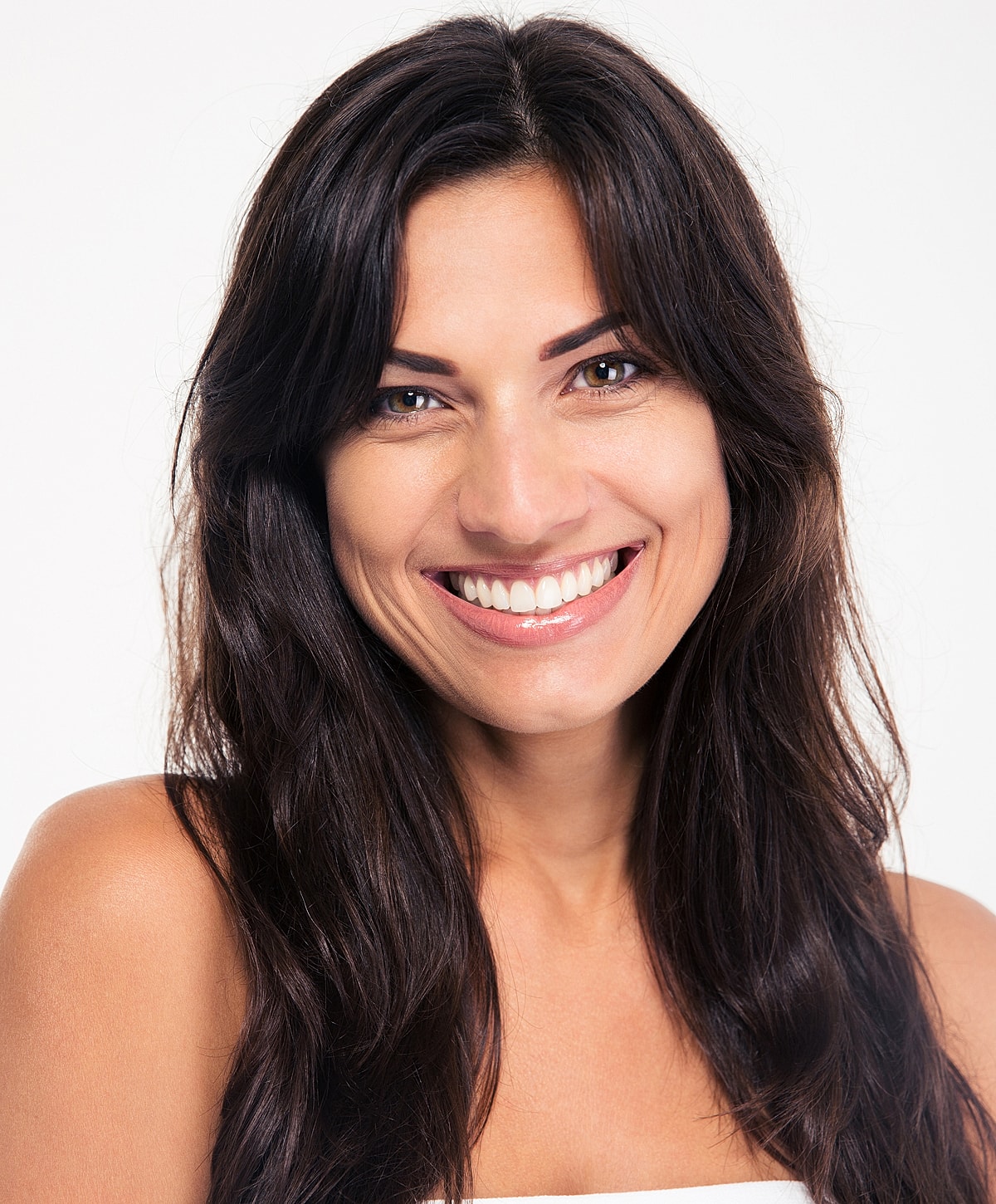 Smiling woman with long dark hair.