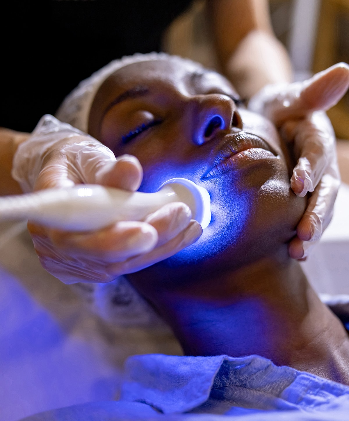 Skincare treatment using blue light therapy.