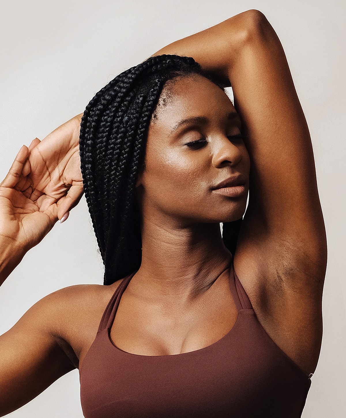 Woman with braided hair posing gracefully.