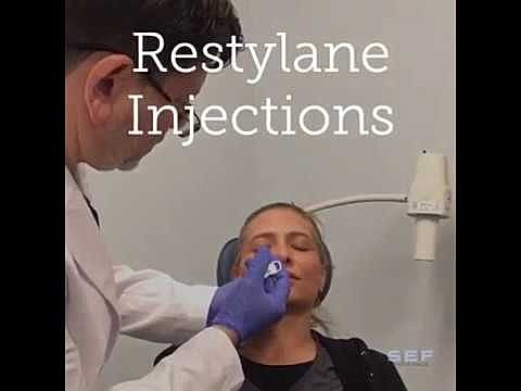 Patient receiving Restylane injections in clinic.