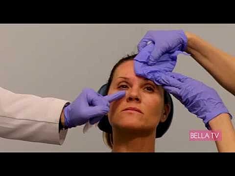 Medical procedure involving facial treatment and consultation.