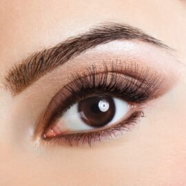 Close up of woman's eye with long eyelashes
