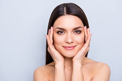 Woman resting her face in her hands