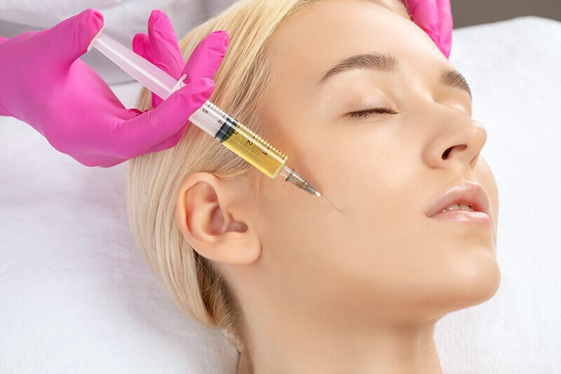 Blond woman having juvederm injection