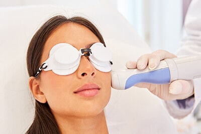Woman having laser treatment