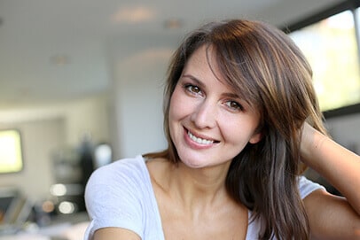 Attractive woman in her thirties smiling at camera